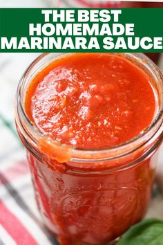 the best homemade marinara sauce in a glass jar with basil leaves on the side