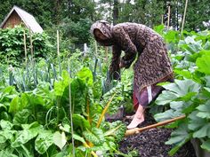 a woman tending to her garden in the rain