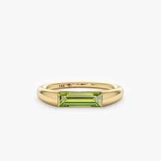 Clarissa Capture the essence of August with the Natural Peridot Ring, a radiant symbol of... Ring Baguette, Solid Gold Bracelet, Channel Setting, August Birthstone, Beautiful Gift Wrapping, Initial Ring, Peridot Ring, Name Jewelry, Initial Jewelry