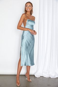 This satin empire waist midi dress is perfect for any special event. It boasts a cowl neck and a tied open back, with a side invisible zipper for easy dressing. It provides a modern, elegant look and comfortable fit. Recommended sizing XS - 0-2, S - 4, M - 6, L - 8-10 Chic Midi-length Slip Dress With Satin Finish, Light Blue Silk Slip Dress, Solid Silk Midi-length Slip Dress, Chic Midi-length Slip Dress With Knotted Straps, Solid Satin Slip Dress, Midi Length, Empire Waist Midi Dress, Cami Slip Dress, Cami Midi Dress, Kids Activewear