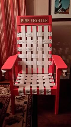 a red and white chair made out of newspaper strips