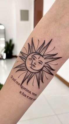 a woman's arm with a sun and moon tattoo on the left inner forearm