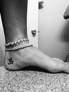 a person with a tattoo on their foot