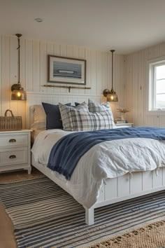 a white bed sitting in a bedroom on top of a blue and white carpeted floor