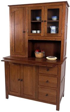 a wooden hutch with glass doors and drawers on it's sides, in front of a white background