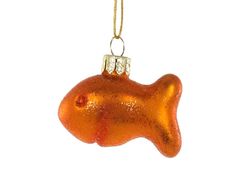 an orange ornament hanging from a gold chain on a white background in the shape of a fish