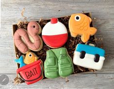 decorated cookies in a box on a table