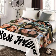 a bed with a blanket that has photos on it