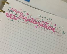 a notepad with the word congratulations written in pink ink on top of lined paper