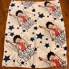 a blanket with an image of a woman in red swimsuit and stars on it