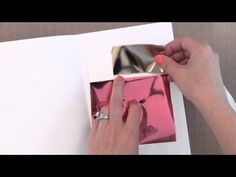 a woman is painting the inside of a box with acrylic paint on it