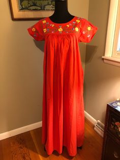 I am offering a 1970s Bloomingdales red cotton peasant dress. This dress has a floral embroidered yoke with gussets and short sleeves. The body of the dress is gathered and is floor length. It is marked as a size small. Measurements on request. Spring Peasant Dress With Short Sleeves, Spring Peasant Short Sleeve Dress, Peasant Style Short Sleeve Spring Dress, Red Folk Style Dress For Spring, Red Cotton Smock Dress, Red Smock Cotton Dress, Red Smock Dress For Spring, Peasant Cotton Dress With Short Sleeves, Short Sleeve Cotton Peasant Dress