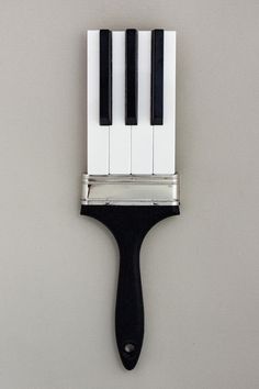 a black and white brush with piano keys on it