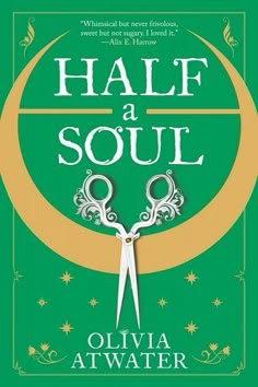 a pair of scissors sitting on top of a green cover with the words half a soul