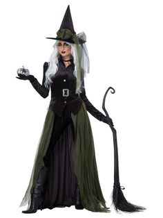 a woman dressed as a witch holding a broom and wearing a black dress with white hair