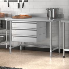 an industrial kitchen with stainless steel cabinets and drawers