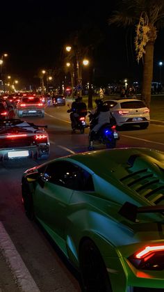 many cars are driving down the street at night