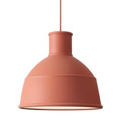 a pink pendant light hanging from a ceiling