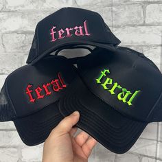 Embroidered Foam Otto Trucker Cap - FERAL Unleash your wild side with our bold and stylish "Feral" trucker cap. This hat is the perfect blend of edgy and comfortable, featuring the word "Feral" embroidered prominently across the front. Whether you're hitting the trails, the streets, or just looking to add a fierce touch to your everyday look, this cap has got you covered. Features: High-Quality Embroidery: The word "Feral" is meticulously embroidered, ensuring durability and a clean, striking lo Punk Cap Hat One Size Fits Most, Punk Style Cap Hat, Casual Black Hat For Music Festival, Punk Style Cap One Size Fits Most, Black Halloween Trucker Hat, Fitted Black Trucker Hat, Black Fitted Trucker Hat, Black Snapback Hat For Summer Festival, Punk Halloween Streetwear Hat