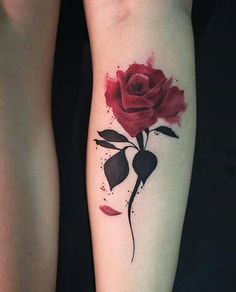 a red rose tattoo on the left arm