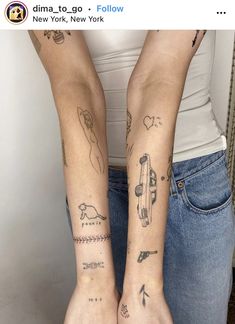 two people with tattoos on their arms and legs, both holding each other's hands