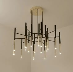 a chandelier with lights hanging from the ceiling