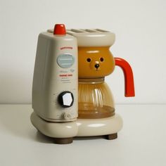 the coffee maker is shaped like a bear