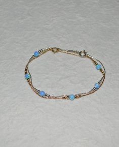 Simple and very elegant Sterling Silver bracelet with blue opal beads. This simple and beautiful piece of jewelry is perfect for a variety of outfits and occasions. M a t e r i a l s Your bracelet can be made of the following materials: Sterling Silver or 14k Gold Filled. Please select material during checkout process. M e a s u r e m e n t s - Available bracelet lengths: 6, 6.5, 7, 7.5, 8 inches - The length of the entire bracelet is measured from end to end - Model on the pics wears 7 inches b Opal Bracelet Gold, Male Body Jewelry, Opal Jewelry Necklace, Blue Opal Jewelry, Gold Bracelet Simple, Jewelry Opal, Black Lady, Silver Ring Designs, Jewelry Advice