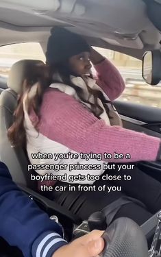 a woman sitting in the passenger seat of a car