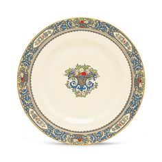 an ornately decorated plate with blue and gold trimmings on the rim,