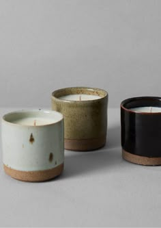 three different types of candles sitting next to each other