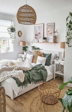 a bedroom with white walls and wooden flooring, wicker baskets on the bed