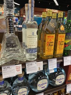 bottles of alcohol are on display in a store