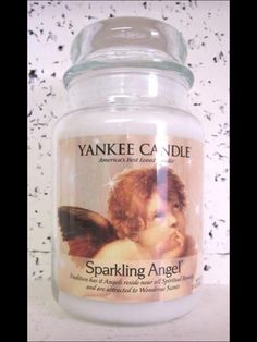 yankee candle jar with an angel image on it