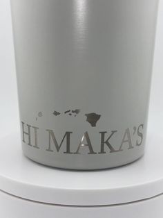 a white cup with the words hi maka's on it