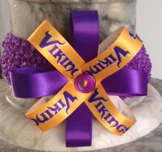 This purple headband with the gold  and purple flower is a perfect way for your girl to help cheer on the Vikings on game day or that dress up day at school. Purple Headband, Purple Headbands, Gold And Purple, Dress Up Day, The Vikings, That Dress, Ribbon Flower, Your Girl, Minnesota Vikings