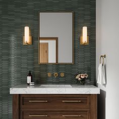 a bathroom vanity with marble counter top and wooden cabinet under a large mirror above it