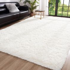 a large white rug in a living room