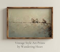 three birds sitting on a branch with the words vintage style art prints by wandering heart