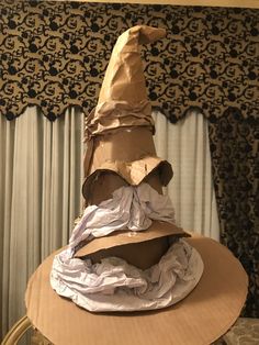 a paper mache hat sitting on top of a table