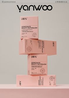 three pink boxes stacked on top of each other in front of a gray background with the words vanwoo