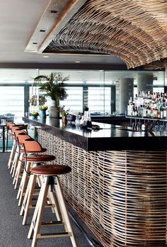 a bar with several stools in front of it