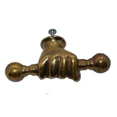 an antique brass door handle on a white background