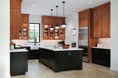 a large kitchen with wooden cabinets and white counter tops