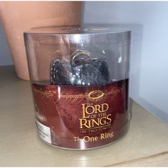 the lord of the rings figurine is in a plastic container