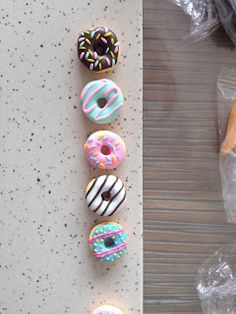 there are six donuts on the table next to each other