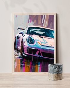 a painting of a porsche gtr on a table next to a vase and candle