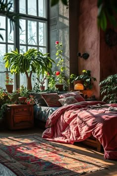 a bedroom with lots of potted plants in the window sill and bedding