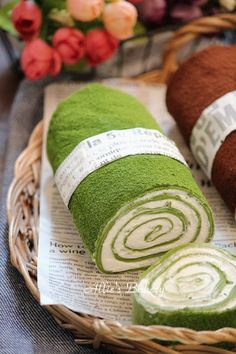 rolled up towels sitting on top of a basket