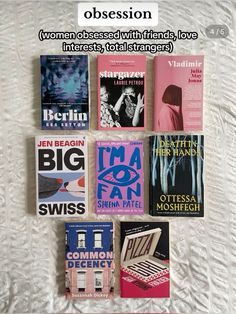 there are many different books on the bed with white sheets in this photo, including women's magazines